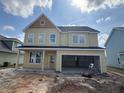 New construction home featuring a spacious two-car garage awaiting completion at 111 Crosscut Ln, Summerville, SC 29486