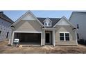 New construction exterior featuring a two-car garage and neutral siding at 116 Crosscut Ln, Summerville, SC 29486