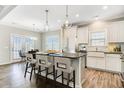 Bright, modern kitchen with granite countertops, island, and stainless steel appliances at 116 Crosscut Ln, Summerville, SC 29486