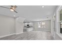 Bright, open living room with recessed lights, ceiling fan, and views of the kitchen at 125 Ridge Rd, Summerville, SC 29485