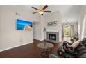 Inviting living room with a cozy fireplace, hardwood floors, and natural light at 130 Shropshire St, Goose Creek, SC 29445