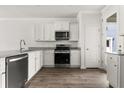 Modern kitchen featuring stainless steel appliances, granite countertops, and white cabinetry at 133 Brant Dr, Summerville, SC 29483