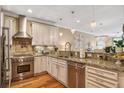 Well-equipped kitchen featuring stainless steel appliances, granite countertops, and ample cabinet space at 1454 Carradale Ln, Mount Pleasant, SC 29466