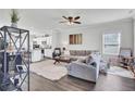 Bright living room with hardwood floors, neutral paint, and views into the kitchen at 165 Clydesdale Cir, Summerville, SC 29486