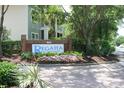 Sign for Regatta on James Island, featuring a brick base with flowers and green landscaping at 1755 Central Park Rd # 9103, Charleston, SC 29412