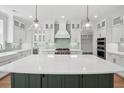 Spacious kitchen featuring a large island, stainless steel appliances, and custom cabinetry at 2006 Riverbend Dr, Charleston, SC 29412