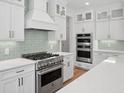 Well-equipped kitchen with stainless steel appliances, custom cabinets, and stone countertops at 2006 Riverbend Dr, Charleston, SC 29412