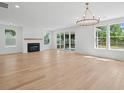 Bright living room featuring hardwood floors, fireplace and lots of natural light at 2006 Riverbend Dr, Charleston, SC 29412