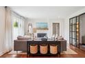 Stylish living room featuring modern furnishings, a fireplace, and access to a second sitting area at 22 Charlestowne Rd, Charleston, SC 29407