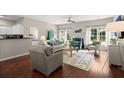 Bright living room with hardwood floors, natural light, and comfortable furnishings at 2845 August Rd, Johns Island, SC 29455