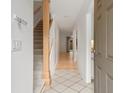 Bright entryway with tile floors, staircase, and view into living space at 321 Lapwing Ln, Mount Pleasant, SC 29464