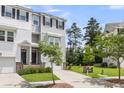 Beautiful townhome with an attached garage and well-maintained lawn, perfect for comfortable living at 348 Spindlewood Way, Charleston, SC 29414