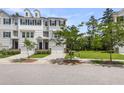 Inviting townhome with a garage, neat landscaping, and a classic design, offering a great curb appeal at 348 Spindlewood Way, Charleston, SC 29414