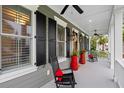 Relaxing front porch featuring classic rocking chairs, stylish lanterns, and picturesque neighborhood views at 3739 Goodwater St, Mount Pleasant, SC 29466