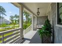 Inviting porch with swing and view of street in quiet residential neighborhood at 3871 Sawyers Island Dr, Mount Pleasant, SC 29466