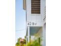 Close up view of home number 42 B and a light blue covered porch at 42 Poinsett St # B, Charleston, SC 29403