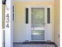 Close-up of the charming front door, showing sidelights, brick accents, and house number at 434 Antebellum Ln, Mount Pleasant, SC 29464