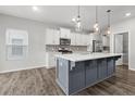 Modern eat-in kitchen featuring stainless steel appliances, large island and hardwood flooring at 514 Purple Finch Rd, Summerville, SC 29486