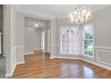 Elegant dining room featuring hardwood floors and a chandelier at 100 Cheshire Dr, Goose Creek, SC 29445