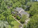 Aerial view of a charming home with mature trees and a well-manicured lawn at 109 Fort St, Summerville, SC 29485