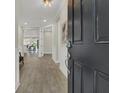 Inviting entryway with wood-look tile floors, neutral walls, and modern lighting at 117 Harbor Trace Ln, Summerville, SC 29486