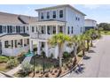 Beautiful three-story home with a quaint balcony, palm trees, and an Aspen Dr sign at 1182 Welcome Dr Dr, Mount Pleasant, SC 29464