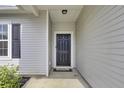 Close up of the home's front door, showing modern hardware and a secure entryway at 121 Ancestry Ln, Moncks Corner, SC 29461