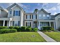 Charming home with manicured lawn, walkway, and classic architectural details at 149 Woodward Rd, Goose Creek, SC 29445