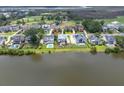 Aerial view of waterfront homes, showing their placement on a river and the proximity to the golf course at 1597 Rivertowne Country Club Dr, Mount Pleasant, SC 29466