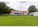 Spacious backyard with a screened in porch and a well-manicured lawn at 160 Syrr Run Rd, Saint George, SC 29477