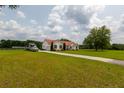 Beautiful ranch-style home featuring a long driveway and a well-maintained lawn at 160 Syrr Run Rd, Saint George, SC 29477