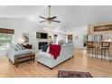 Spacious living room with hardwood floors, white paint, fireplace, and modern decor at 1604 Macoma Dr, Mount Pleasant, SC 29466