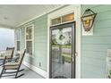 Charming porch with rocking chairs, decorative wreath, and welcoming ambiance at 1822 Grovehurst Dr, Charleston, SC 29414