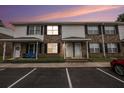 Charming townhome with brick facade, covered entrances and well-lit parking area at 2045 Rondo St # B, Charleston, SC 29414