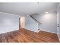 Comfortable living area featuring hardwood floors, neutral paint, and a staircase at 2045 Rondo St # B, Charleston, SC 29414