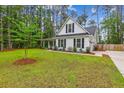 Well-maintained home with a large, lush lawn, mature trees, and charming curb appeal at 206 Almond Ct, Summerville, SC 29483