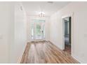Bright foyer with wood flooring, a modern light fixture, and ample natural light at 206 Almond Ct, Summerville, SC 29483