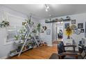 Bright living room featuring hardwood floors, built in shelving, and eclectic decor at 2651 Martha Dr, North Charleston, SC 29405