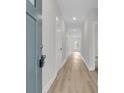 Bright hallway with recessed lighting and wood flooring, leading to various rooms in the home at 3222 Pinewood Dr, Ladson, SC 29456