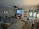 Cozy living room features a modern fireplace, TV, and a comfortable sectional sofa at 5021 Popperdam Creek Dr, North Charleston, SC 29418