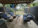 Relaxing outdoor patio area with comfortable seating, perfect for entertaining or enjoying the outdoors at 5021 Popperdam Creek Dr, North Charleston, SC 29418