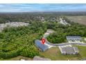 Aerial view showcases property location nestled between beautiful trees and a serene marsh at 5133 Park Creek Ave, North Charleston, SC 29418