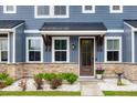 Inviting front porch with stone accents, wood trim, and a decorative flower pot at 5133 Park Creek Ave, North Charleston, SC 29418