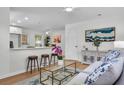 Inviting living room featuring modern decor, a comfortable couch, and a seamless flow to the breakfast bar at 5172 Sterrett St, North Charleston, SC 29405