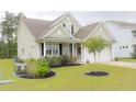 A well-kept home featuring tidy landscaping, verdant lawns, and an attached two-car garage at 683 Yellow Leaf Ln, Summerville, SC 29486