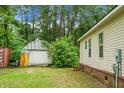 The home's exterior featuring a garage-style shed and some greenery at 785 Coral Acres Dr, Moncks Corner, SC 29461