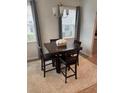 Cozy dining area featuring modern chandelier and natural light at 9410 Sweep Dr, Summerville, SC 29485