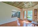 Cozy living room with hardwood floors, detailed ceilings, and natural light at 9682 Pebble Creek Blvd, Summerville, SC 29485