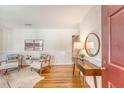 Bright, stylish living room featuring hardwood floors, wainscotting, and elegant decor with warm natural light at 1 Bossis Dr, Charleston, SC 29407