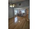 Open-concept living and dining area featuring hardwood floors and natural light at 103 Dupont Way, Summerville, SC 29485